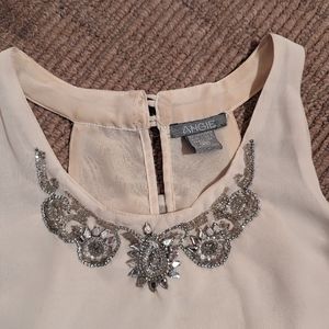 Beautiful flowy top with sequin neckline